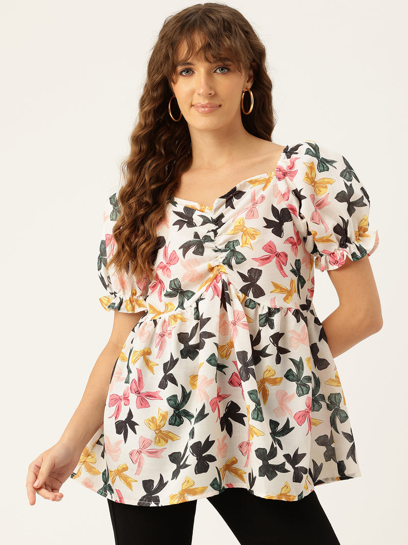 Cropped v-neck peplum puff sleeved top with digital print on linen fabric.