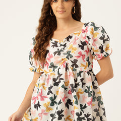 Cropped v-neck peplum puff sleeved top with digital print on linen fabric.