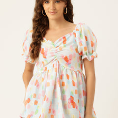 Cropped v-neck peplum puff sleeved top with digital print on linen fabric.