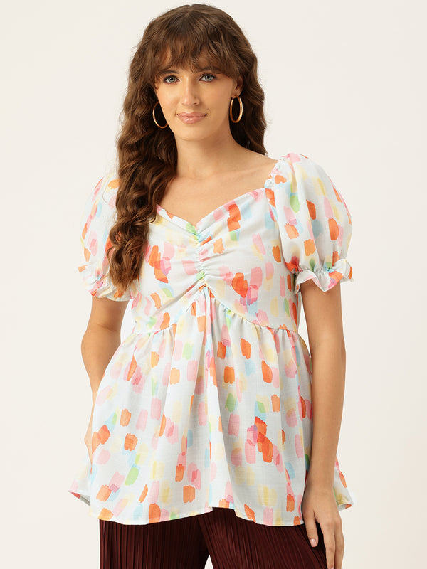 Cropped v-neck peplum puff sleeved top with digital print on linen fabric.