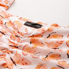 Cropped v-neck peplum puff sleeved top with digital print on linen fabric.