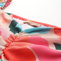 Cropped v-neck peplum puff sleeved top with digital print on linen fabric.