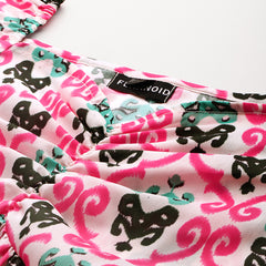 Cropped v-neck peplum puff sleeved top with digital print on linen fabric.