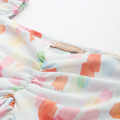 Cropped v-neck peplum puff sleeved top with digital print on linen fabric.