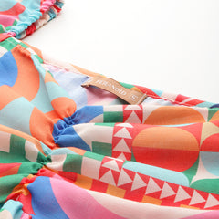 Cropped v-neck peplum puff sleeved top with digital print on linen fabric.