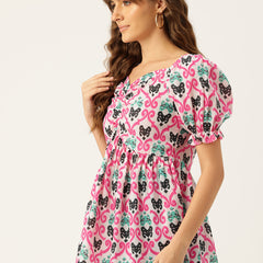 Cropped v-neck peplum puff sleeved top with digital print on linen fabric.