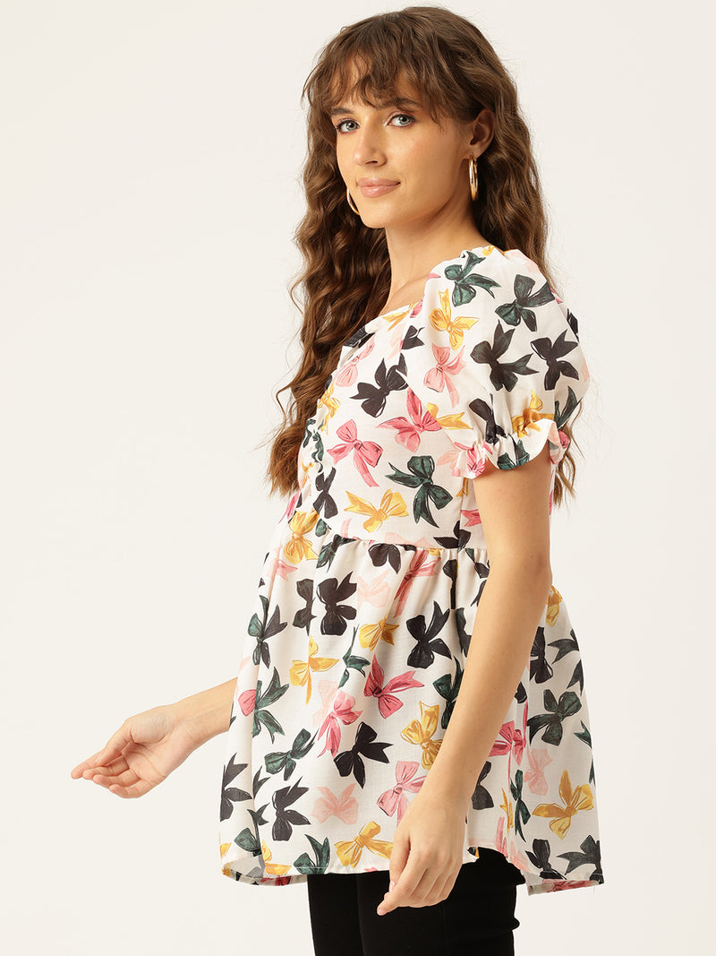 Cropped v-neck peplum puff sleeved top with digital print on linen fabric.