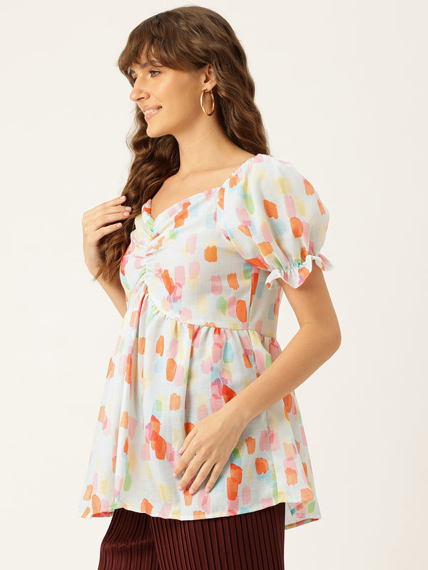 Cropped v-neck peplum puff sleeved top with digital print on linen fabric.