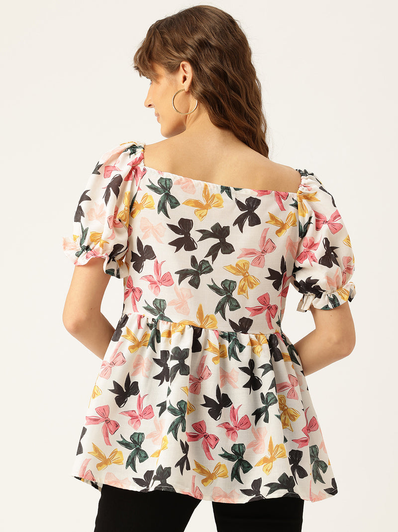 Cropped v-neck peplum puff sleeved top with digital print on linen fabric.