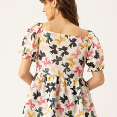 Cropped v-neck peplum puff sleeved top with digital print on linen fabric.