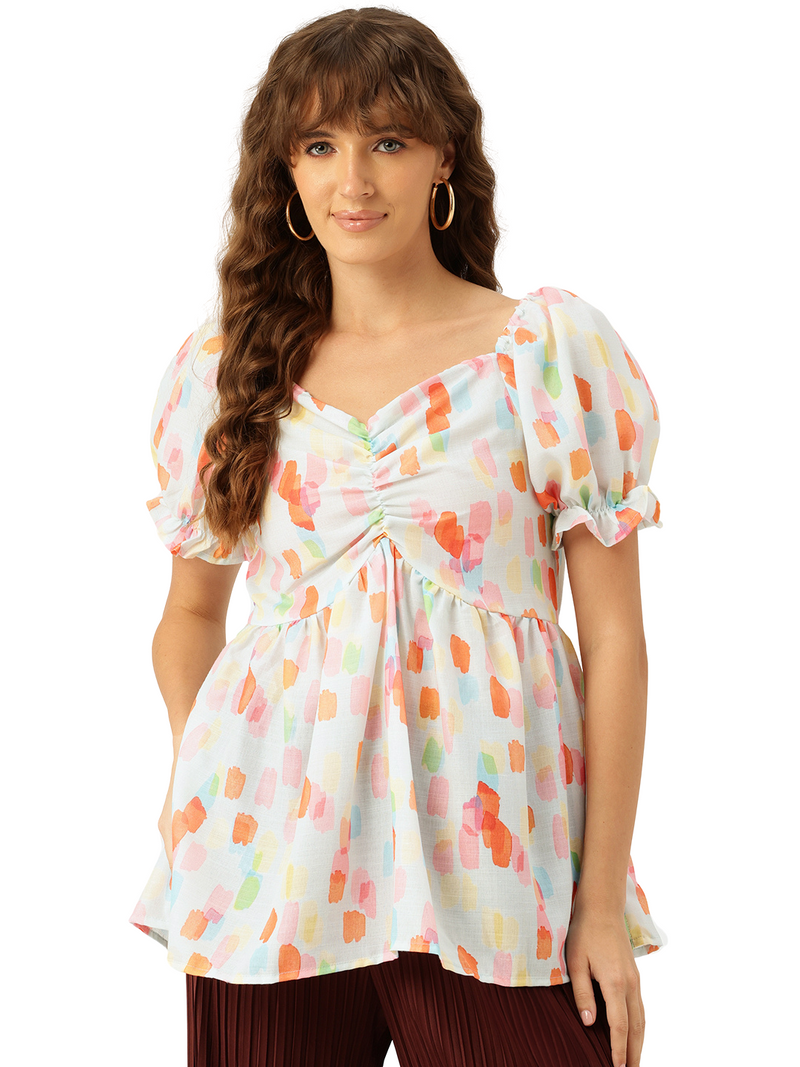 Cropped v-neck peplum puff sleeved top with digital print on linen fabric.