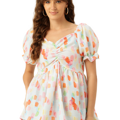 Cropped v-neck peplum puff sleeved top with digital print on linen fabric.