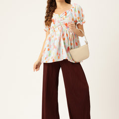 Cropped v-neck peplum puff sleeved top with digital print on linen fabric.
