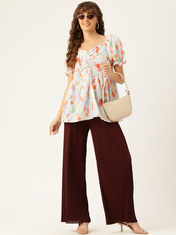 Cropped v-neck peplum puff sleeved top with digital print on linen fabric.