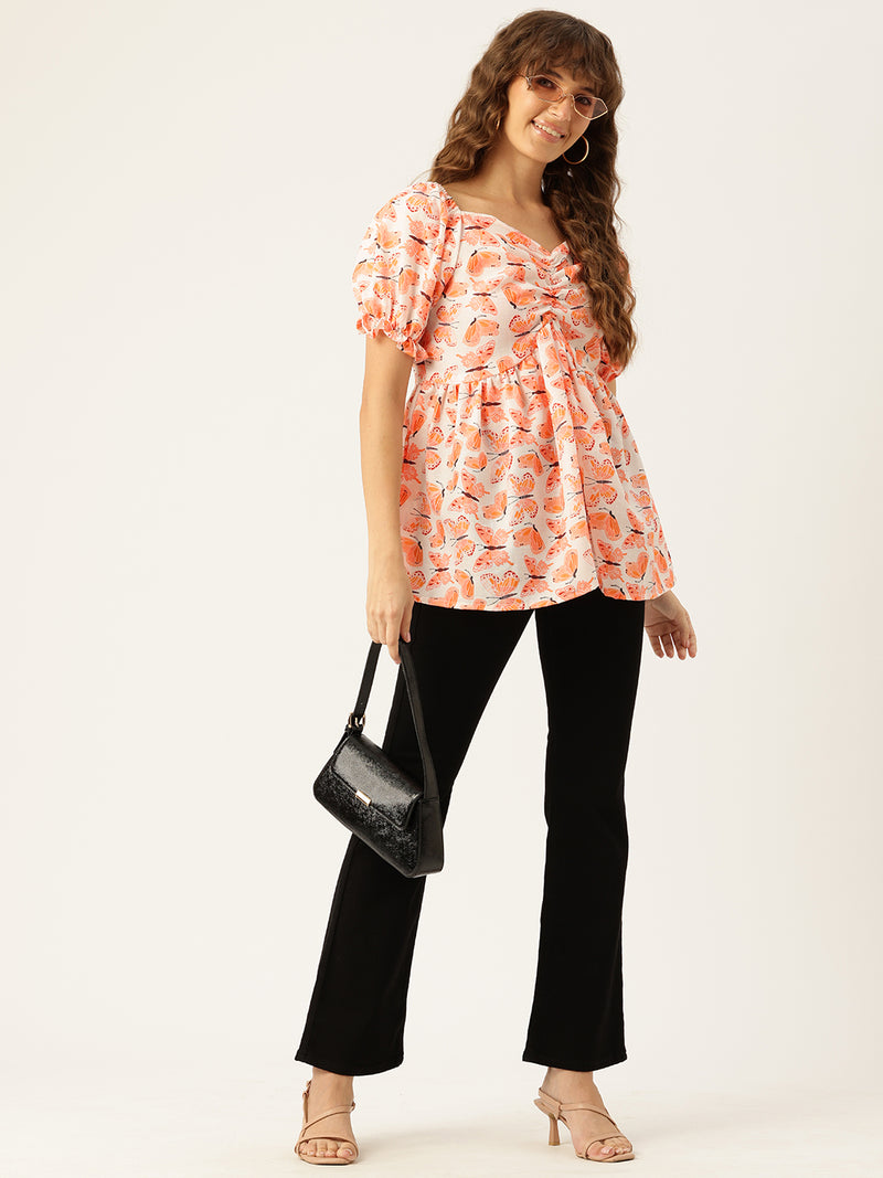Cropped v-neck peplum puff sleeved top with digital print on linen fabric.
