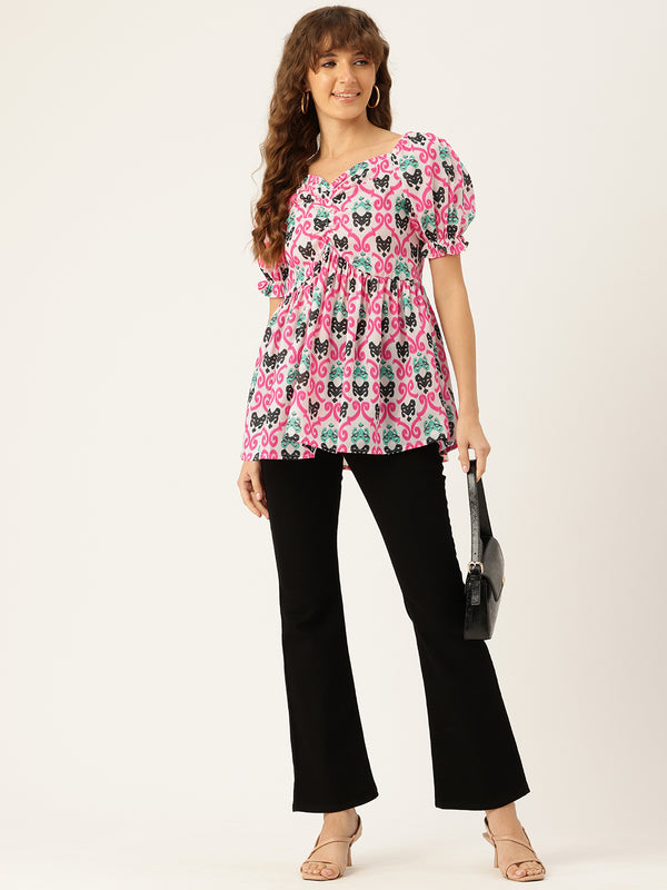 Cropped v-neck peplum puff sleeved top with digital print on linen fabric.