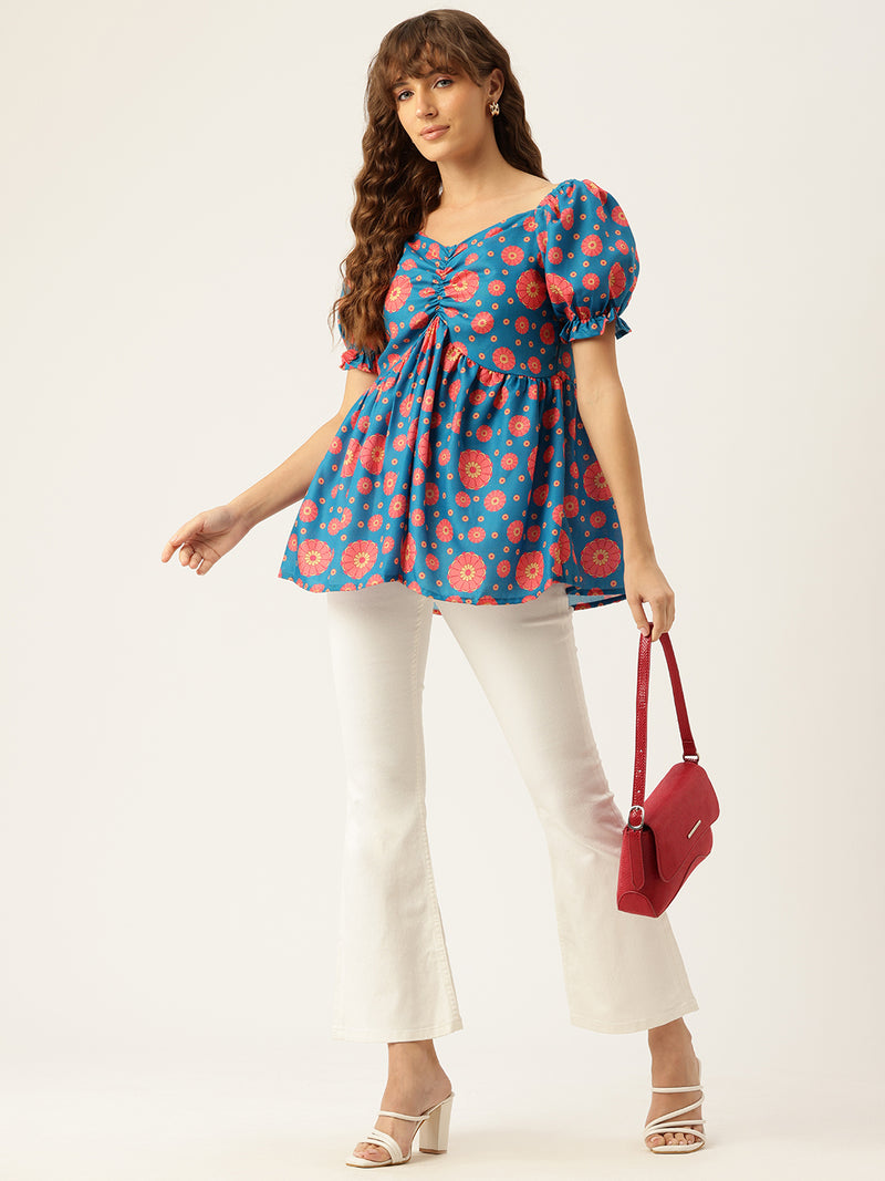 Cropped v-neck peplum puff sleeved top with digital print on linen fabric.