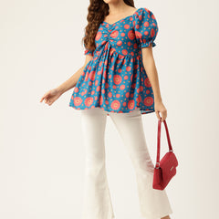 Cropped v-neck peplum puff sleeved top with digital print on linen fabric.