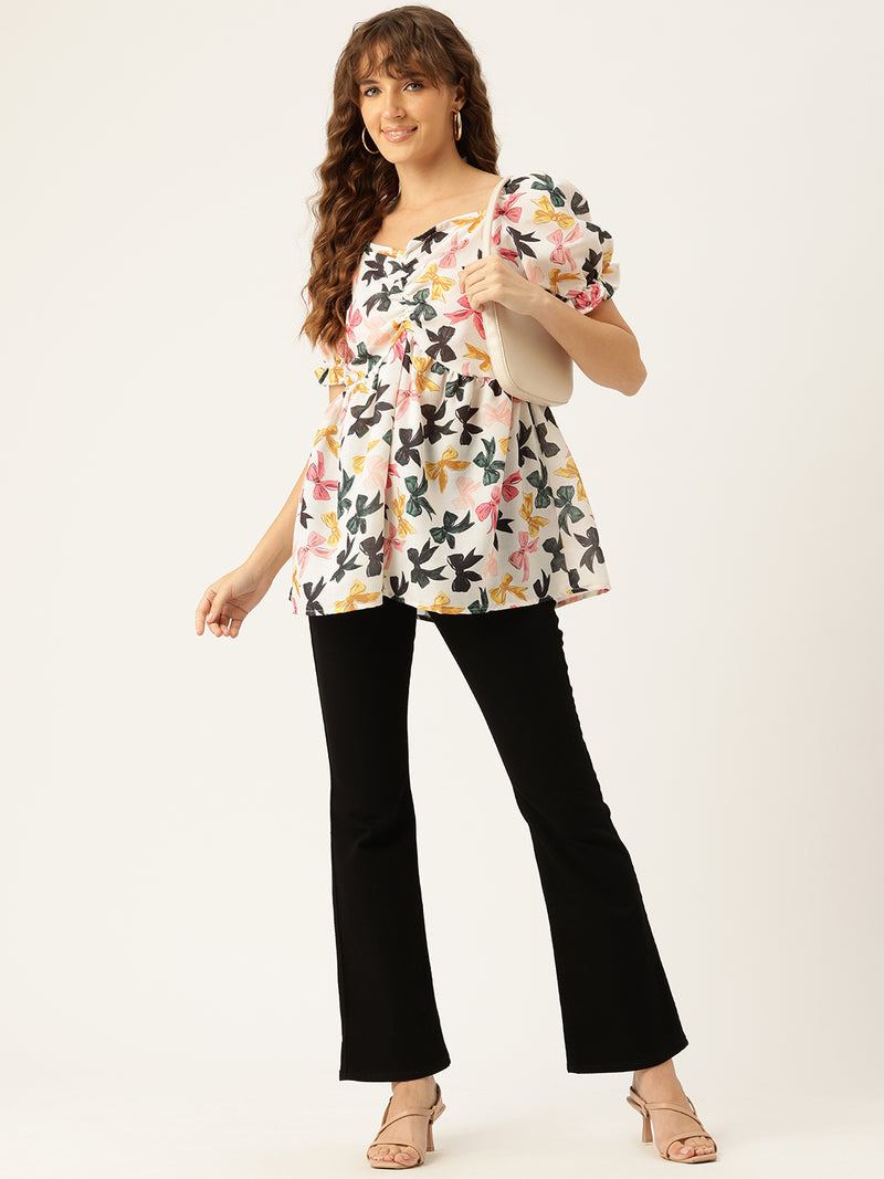 Cropped v-neck peplum puff sleeved top with digital print on linen fabric.