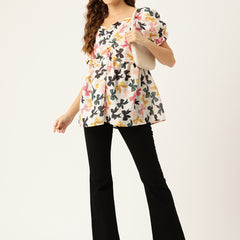 Cropped v-neck peplum puff sleeved top with digital print on linen fabric.