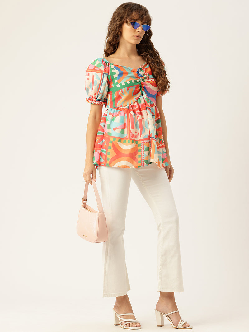 Cropped v-neck peplum puff sleeved top with digital print on linen fabric.